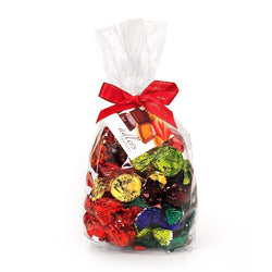 loose adlers assortment twist wrapped truffles in a variety of coloured foils in a clear cello bag with red satin ribbon and tag