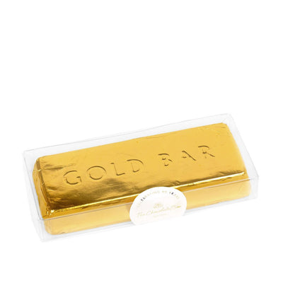 Milk solid chocolate gold bar, in the shape of a gold ingot, wrapped in in gold foil, with the words "GOLD BAR" engraved into the chocolate 
